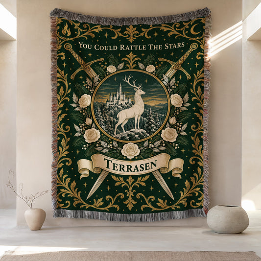 Terrasen Crest Woven Throw Blanket hanging on a wall