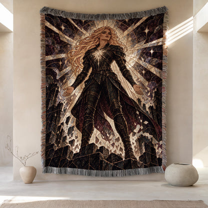 Asterin's Yielding Woven Throw Blanket hanging on a wall
