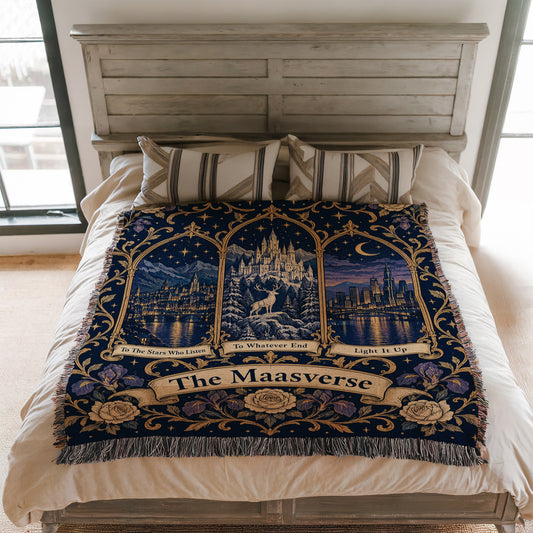 Maasverse Three Realms Crest Woven Throw Blanket on a bed