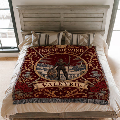Valkyrie House of Wind Crest Woven Throw Blanket on a bed