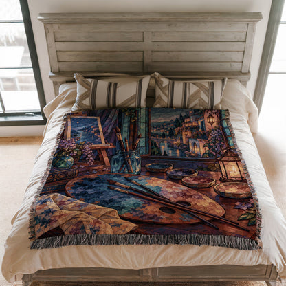 The Rainbow of Velaris Woven Throw Blanket on a bed