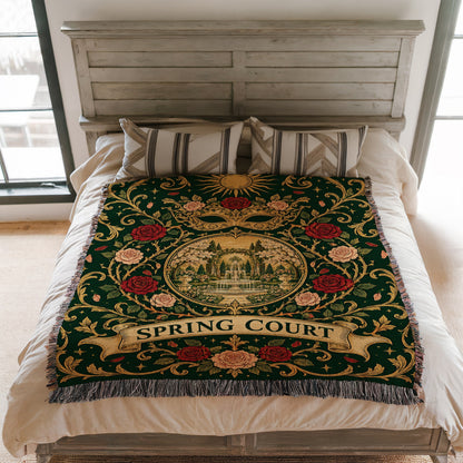 Spring Court Masquerade Crest Woven Throw Blanket on a bed