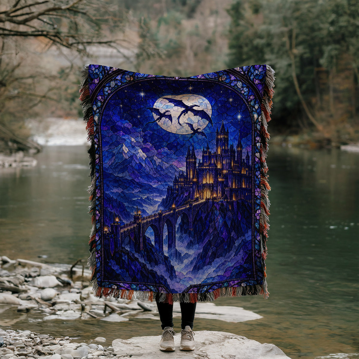 Basgiath by Night Stained Glass Woven Throw Blanket held up by a river
