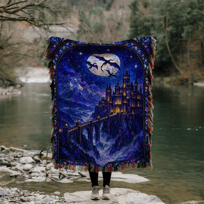 Basgiath by Night Stained Glass Woven Throw Blanket held up by a river