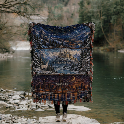 Winter Maasverse Stained Glass Woven Throw Blanket held up by a river