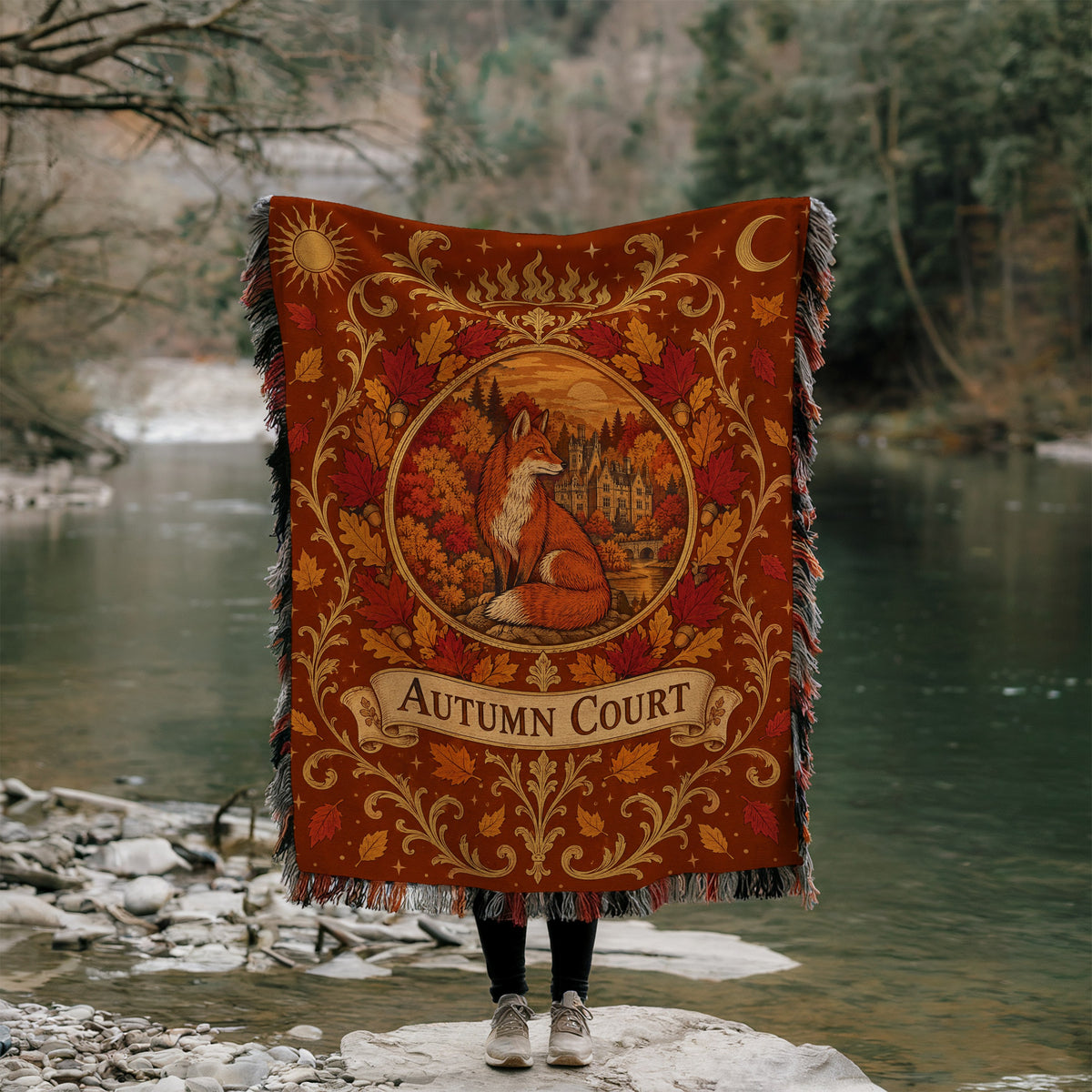 Autumn Court Fox Crest Woven Throw Blanket held up by a river