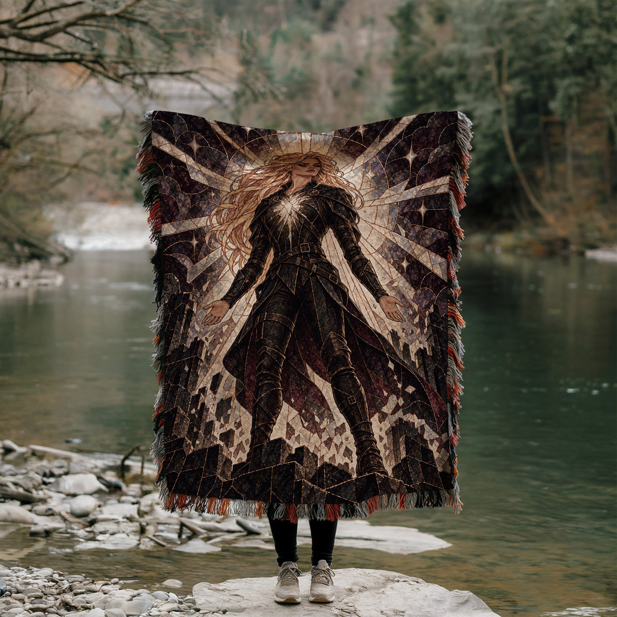 Asterin's Yielding Woven Throw Blanket held up outdoors by a river