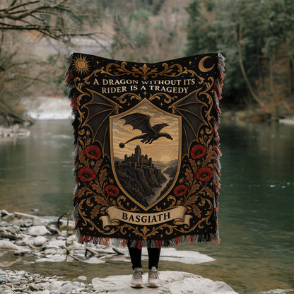 Basgiath Dragon Rider Crest Woven Throw Blanket held up by a river