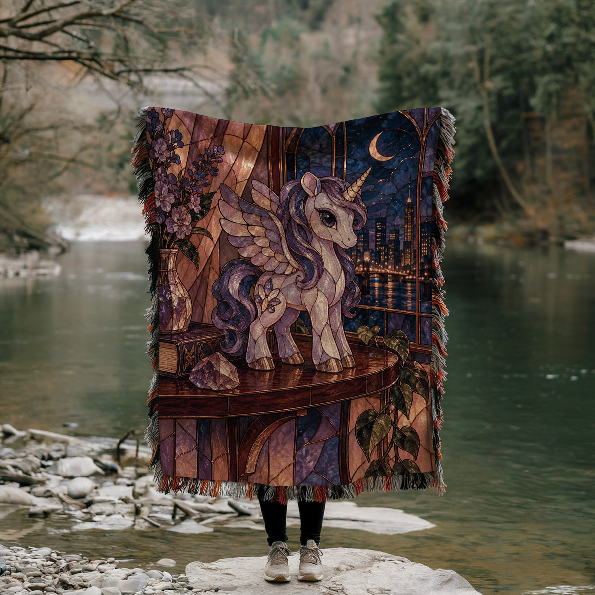 Pegasus Woven Throw Blanket held up outdoors by a river
