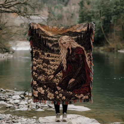 Flowers for the Fallen Woven Throw Blanket held up outdoors by a river