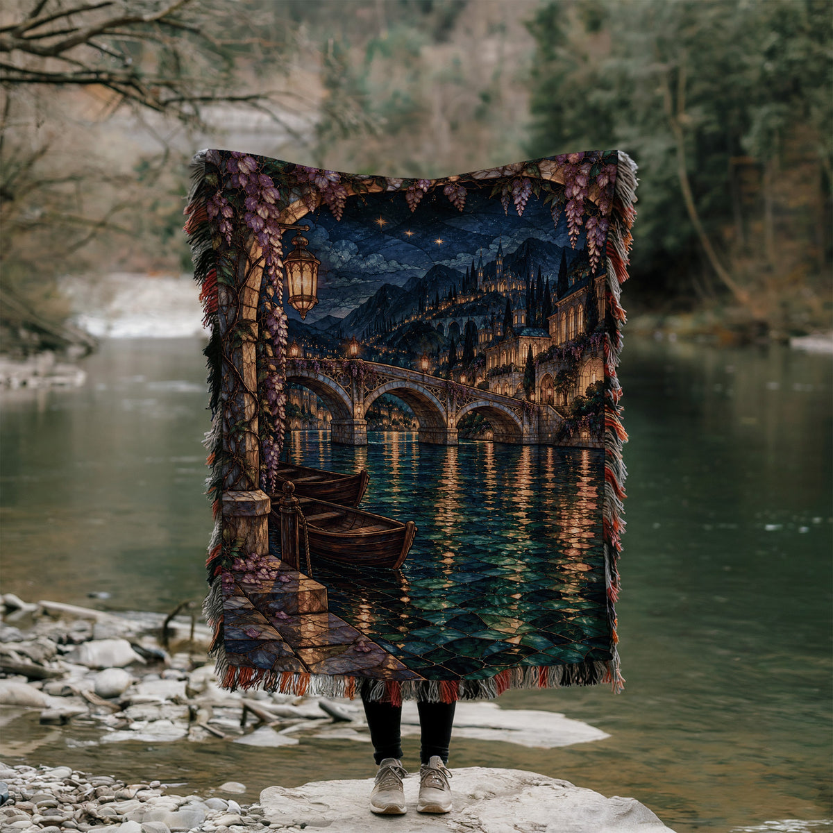 Velaris Woven Throw Blanket held up outdoors by a river