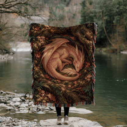 Golden Dragon Woven Throw Blanket held up outdoors by a river