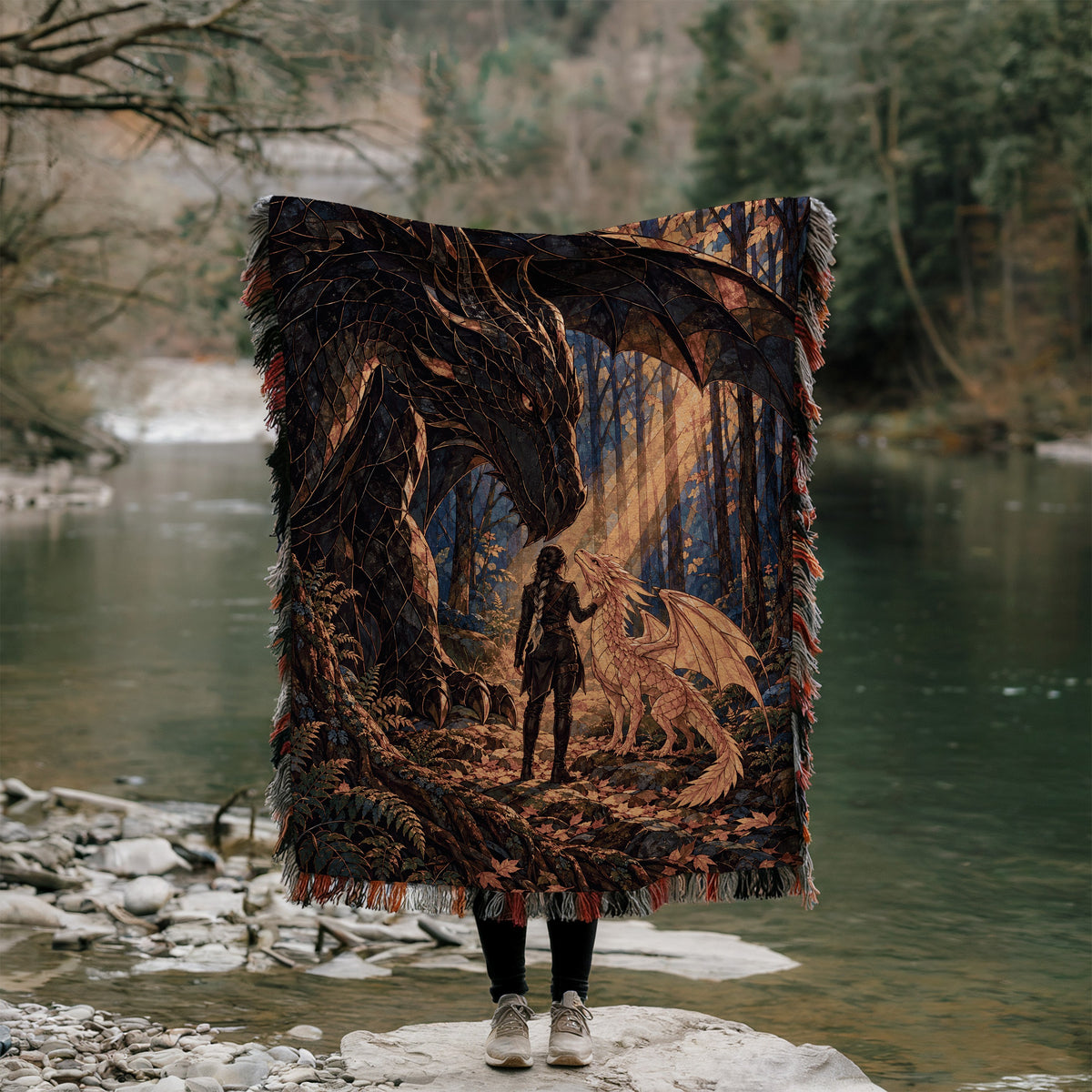 Three Bonds Woven Throw Blanket held up outdoors by a river