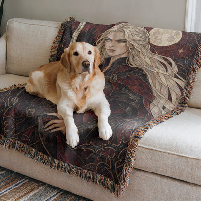 Iron Queen Woven Throw Blanket on a sofa with a dog