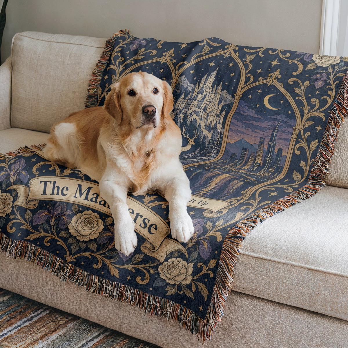 Maasverse Three Realms Crest Woven Throw Blanket on a sofa with a dog
