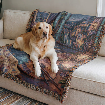 The Rainbow of Velaris Woven Throw Blanket on a sofa with a dog