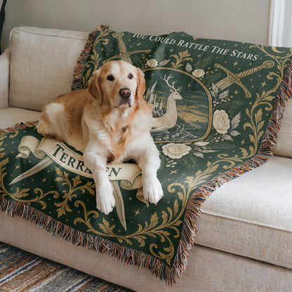 Terrasen Crest Woven Throw Blanket on a sofa with a dog