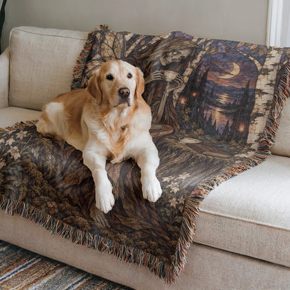 Suriel Tea Woven Throw Blanket on a sofa with a dog