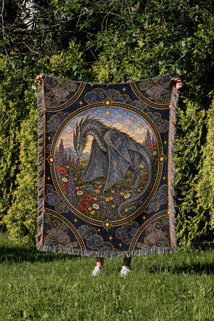 Abraxos in Bloom Stained Glass Woven Throw Blanket held up in a garden