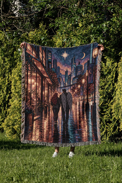 Lunathion Woven Throw Blanket held up in a garden