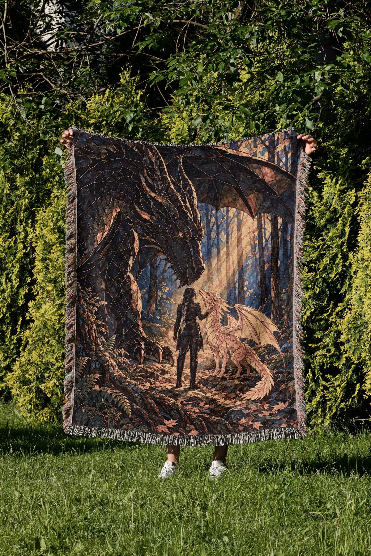 Three Bonds Woven Throw Blanket held up in a garden