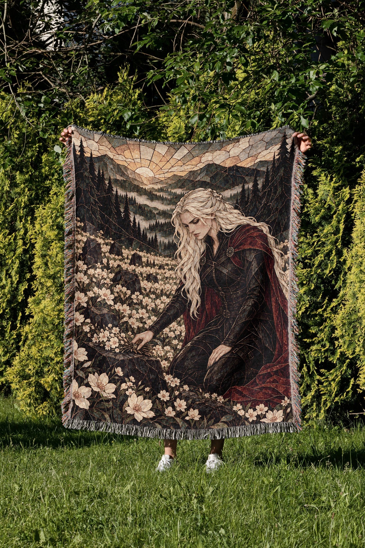 Flowers for the Fallen Woven Throw Blanket held up in a garden