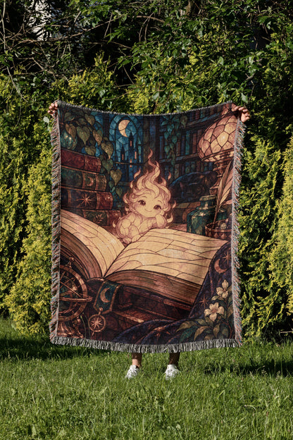 Ember Woven Throw Blanket held up in a garden