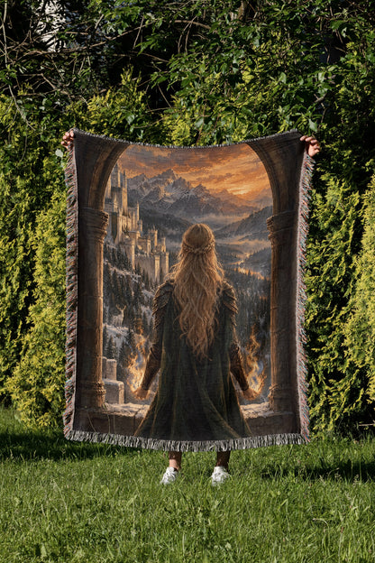 Aelin on the Walls of Orynth Woven Throw Blanket held up in a garden