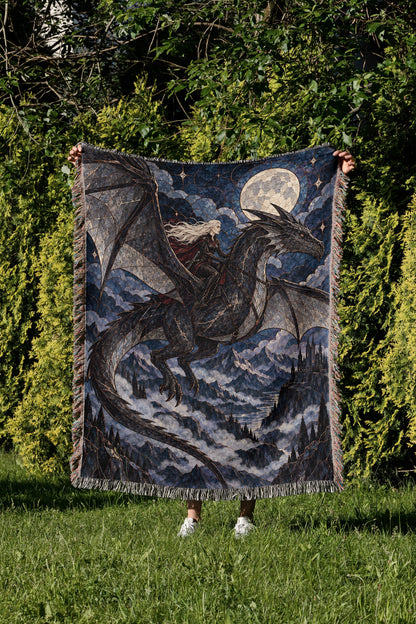 Above the Storm Woven Throw Blanket held up in a garden