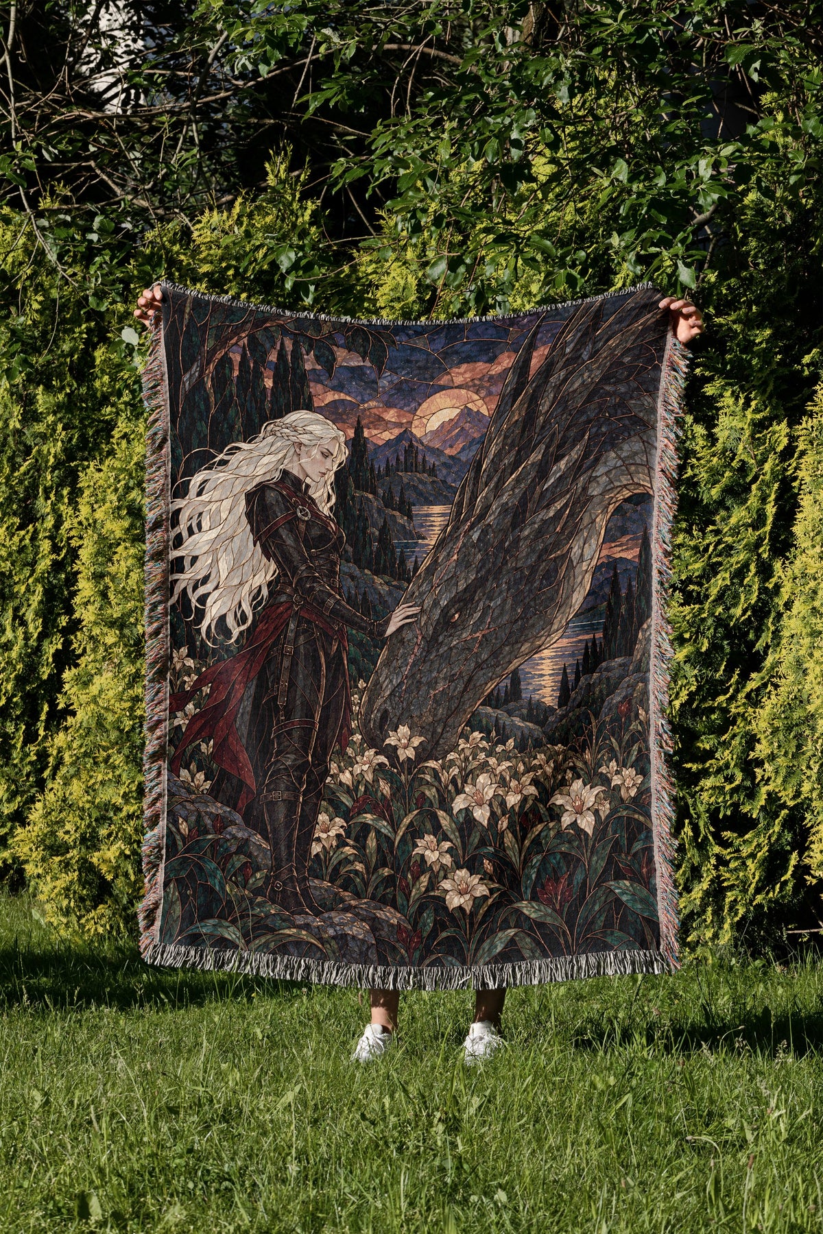 Wildflower Truce Woven Throw Blanket held up in a garden