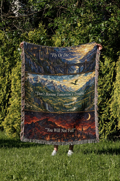 Empyrean Stained Glass Woven Throw Blanket held up in a garden