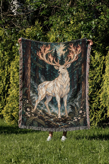 Terrasen Stag Woven Throw Blanket held up in a garden