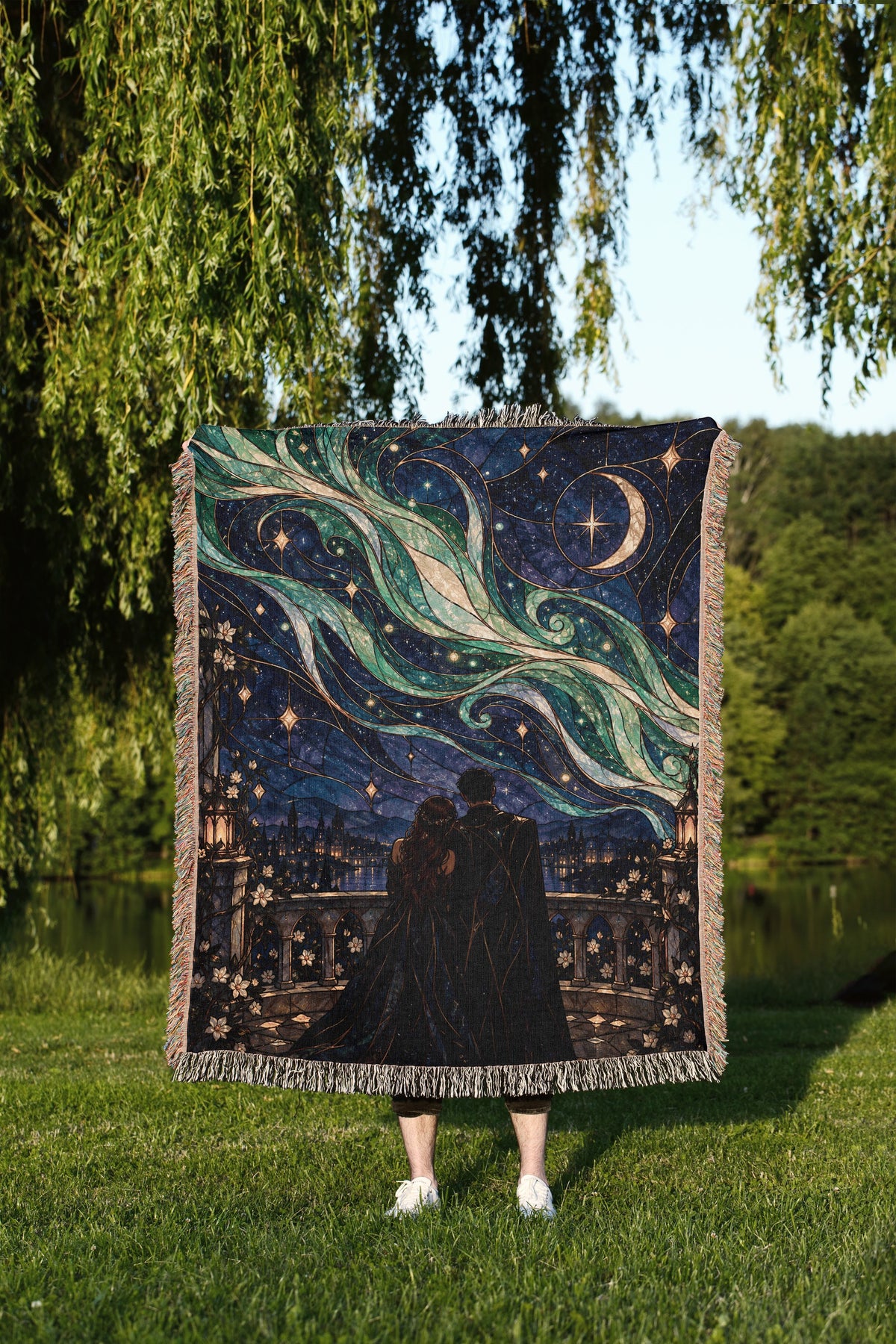 Starfall Stained Glass Woven Throw Blanket held up outdoors