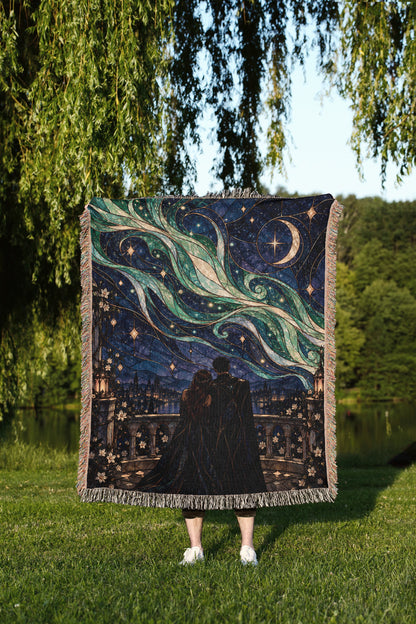 Starfall Stained Glass Woven Throw Blanket held up outdoors