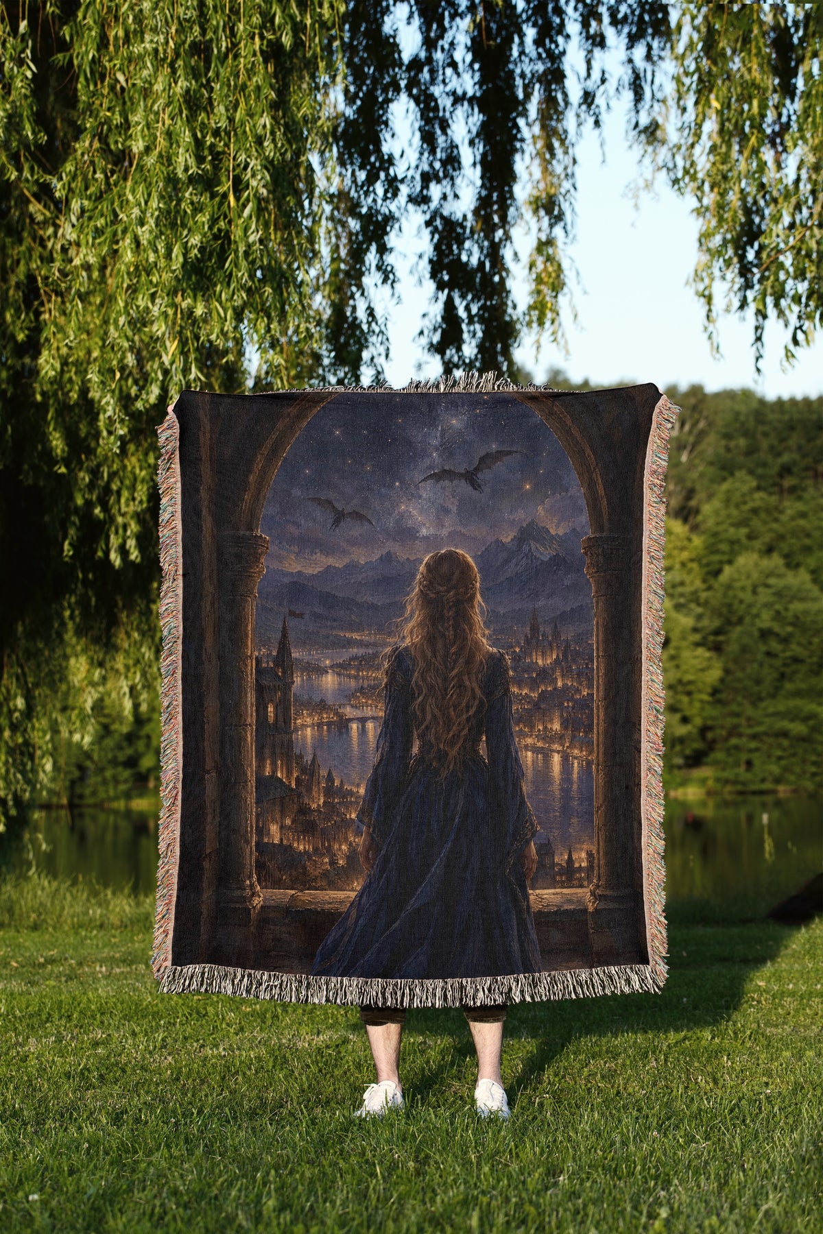 Feyre over Velaris Woven Throw Blanket held up outdoors