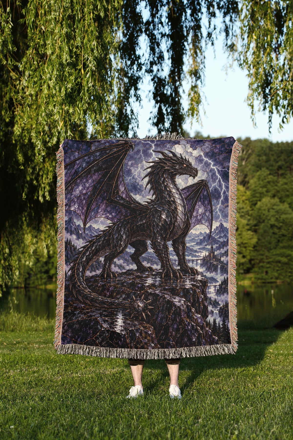 Storm Tairn Woven Throw Blanket held up outdoors