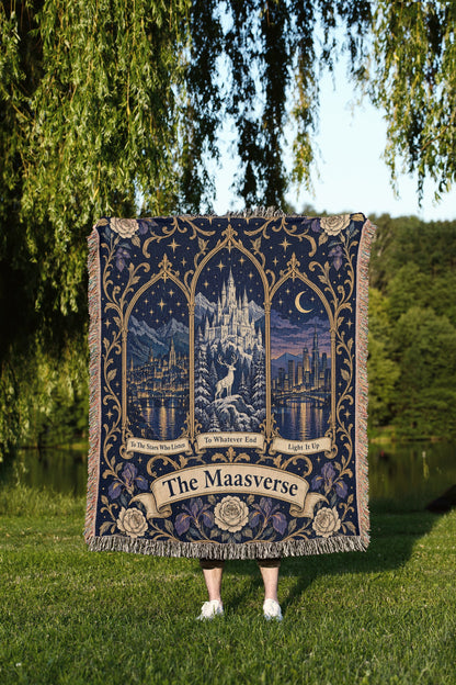 Maasverse Three Realms Crest Woven Throw Blanket held up outdoors