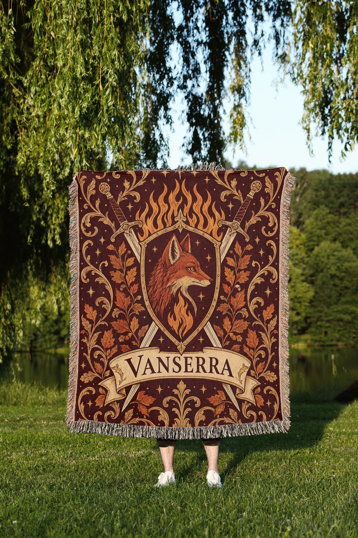 Vanserra Crest Woven Throw Blanket held up outdoors