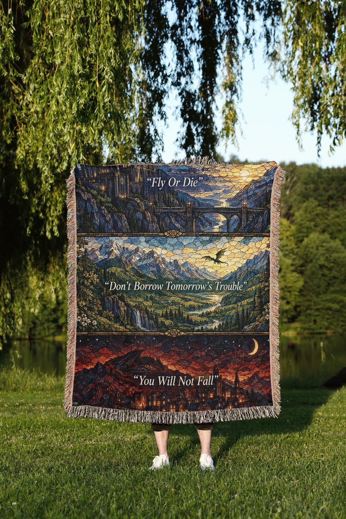 Empyrean Stained Glass Woven Throw Blanket held up outdoors