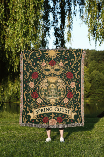 Spring Court Masquerade Crest Woven Throw Blanket held up outdoors