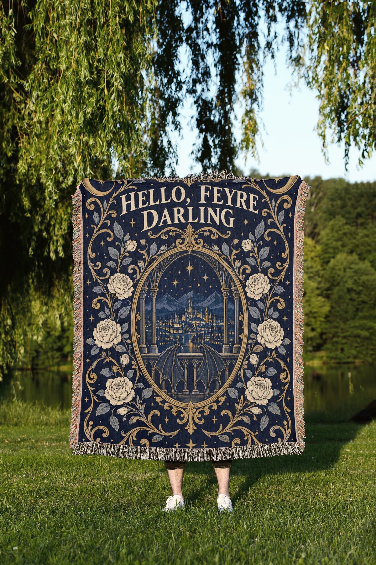 Hello Feyre Darling Crest Woven Throw Blanket held up outdoors