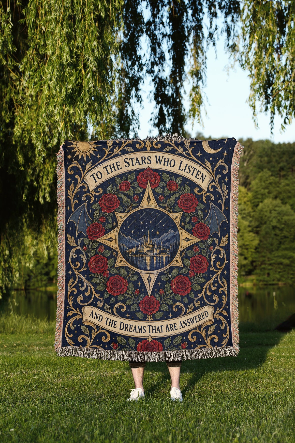 To The Stars Who Listen Rose Crest Woven Throw Blanket held up outdoors