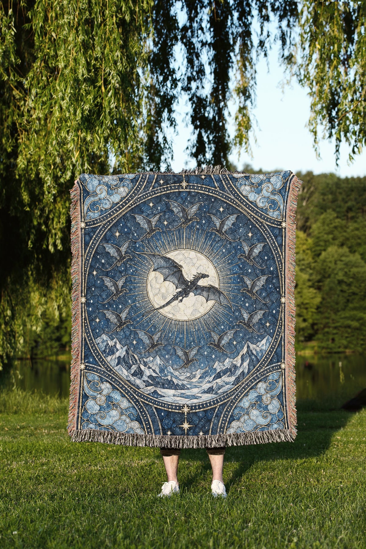 The Thirteen Stained Glass Woven Throw Blanket held up outdoors