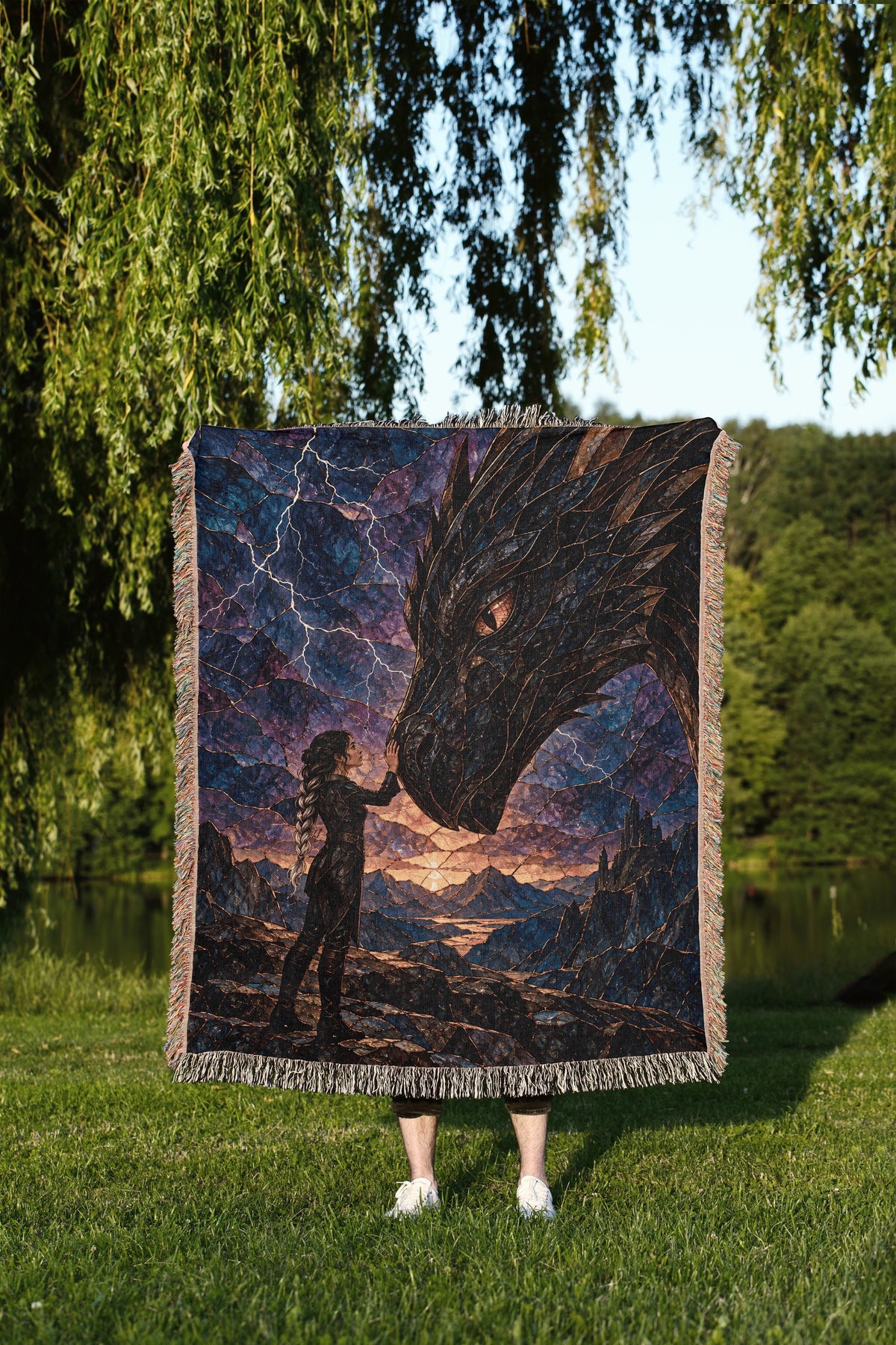 Dragon Rider Woven Throw Blanket held up outdoors