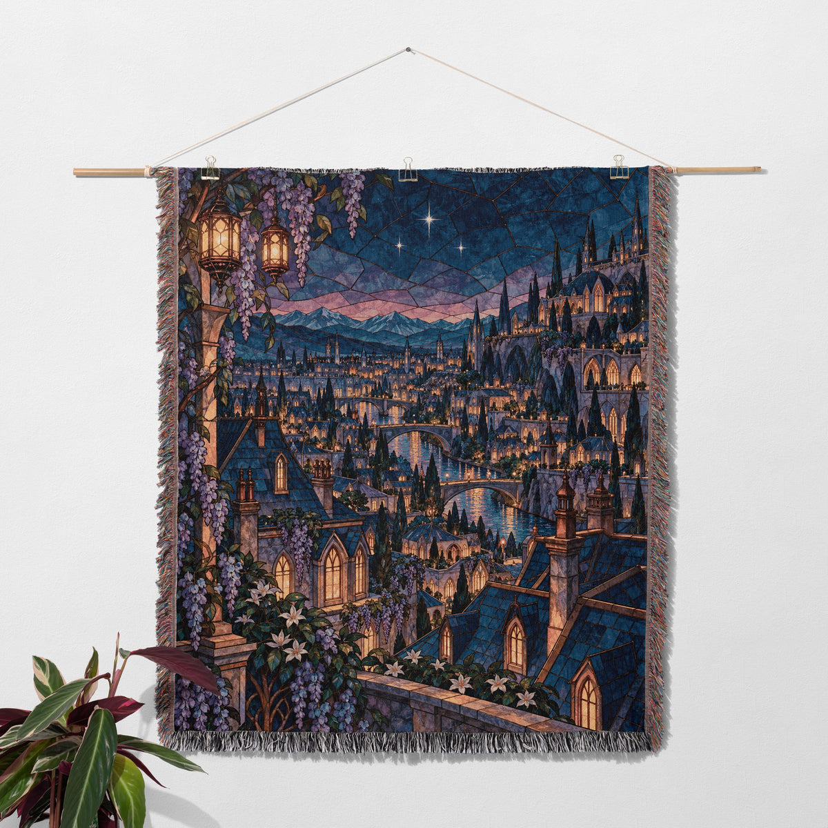 Velaris Rooftop Woven Throw Blanket hanging on a wall with a plant