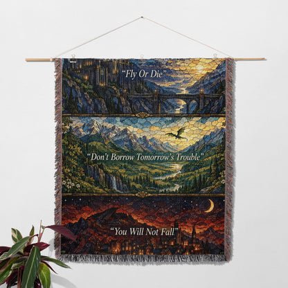Empyrean Stained Glass Woven Throw Blanket hanging on a wall with a plant