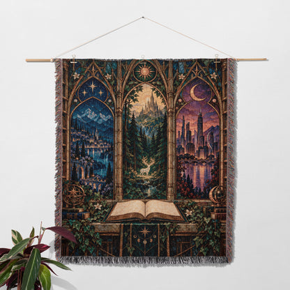 Maasverse Realms Woven Throw Blanket hanging on a wall with a plant