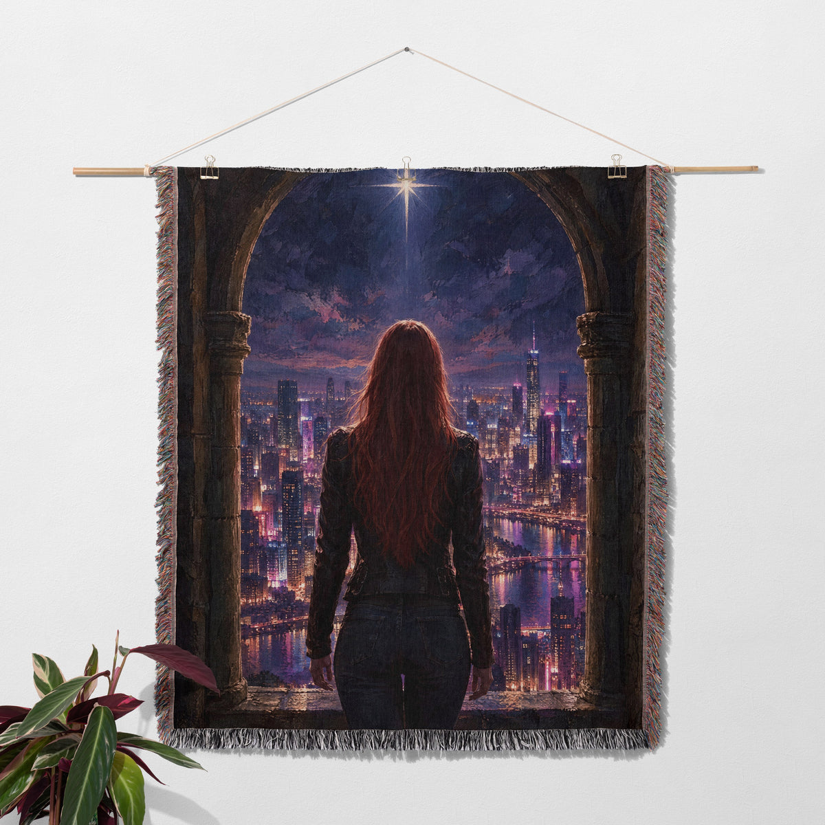 Bryce over Lunathion Woven Throw Blanket hanging on a wall with a plant
