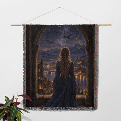 Feyre over Velaris Woven Throw Blanket hanging on a wall with a plant