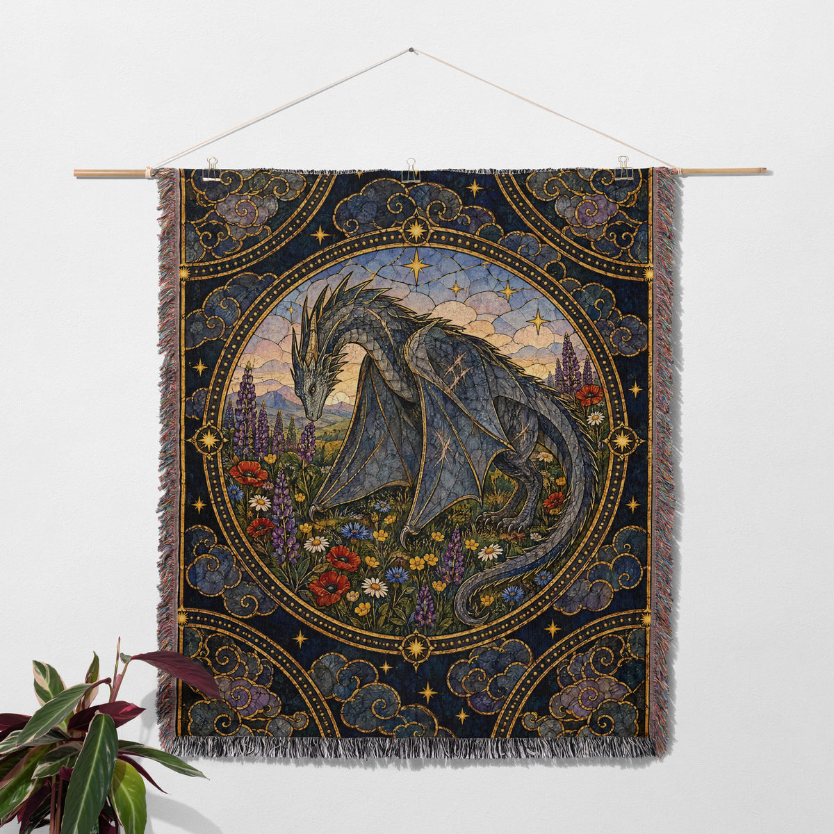 Abraxos in Bloom Stained Glass Woven Throw Blanket hanging on a wall with a plant